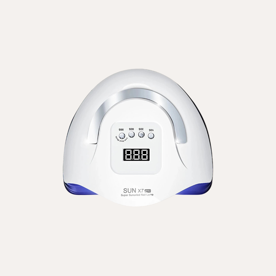 White nail dryer with digital display on a beige background